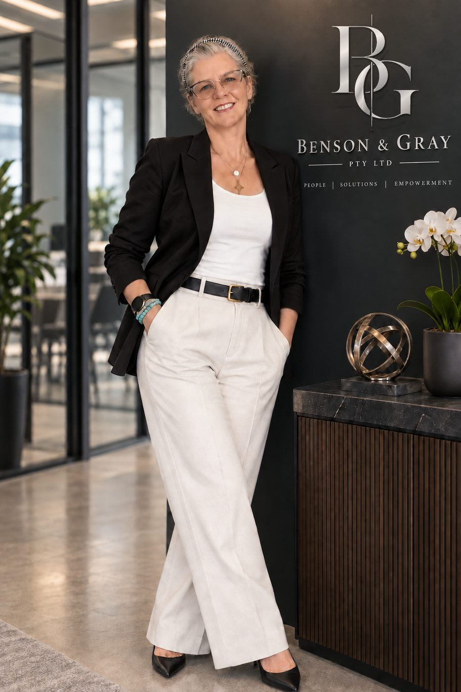 Tanja Gray, Managing Director and Principal Architect, beside the Benson & Gray monogram