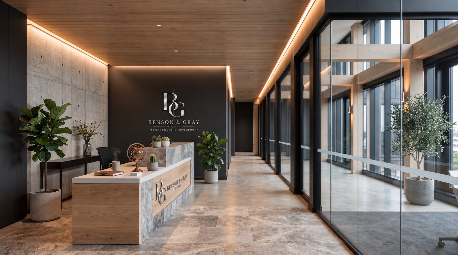 The Benson & Gray reception, with the monogram on a charcoal wall above a timber and marble desk